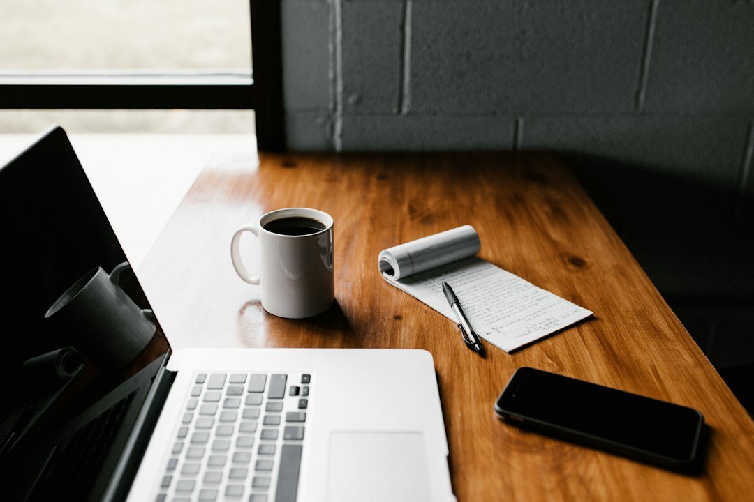 Office desk and laptop representing healthcare compliance and licensing document preparation
