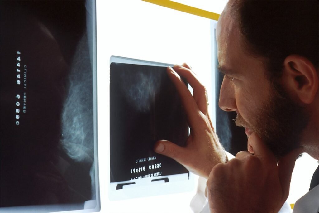 Medical imaging professional reviewing diagnostic X-ray images