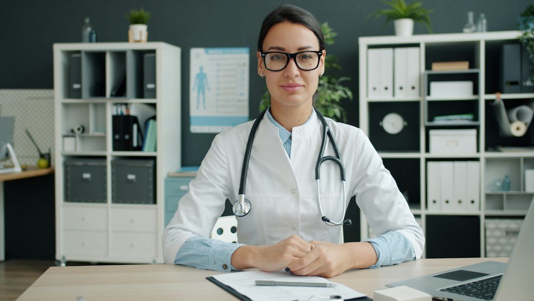 Doctor in a healthcare office representing professional licensing in Sharjah